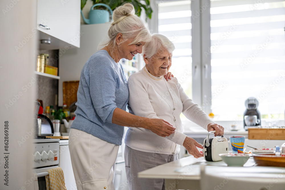 Wall mural elderly woman with her caregiver at nursing home