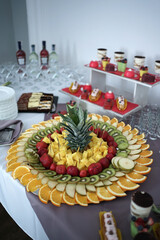 Sweet buffet with cakes, mousses and fruits.