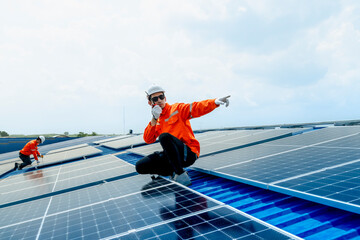 engineer man inspects construction of solar cell panel or photovoltaic cell by electronic device. Industrial Renewable energy of green power. factory worker working on tower roof.