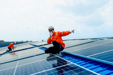 engineer man inspects construction of solar cell panel or photovoltaic cell by electronic device....