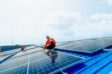engineer man inspects construction of solar cell panel or photovoltaic cell by electronic device....