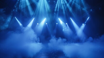 Empty stage illuminated with vibrant blue lights and enveloped in smoke, creating a dramatic and atmospheric scene.