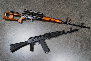 Russian military weapons, SVD sniper rifle and ak74m assault rifle. Close up photo.