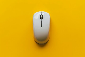 White computer mouse on yellow background. Technology concept with minimalistic product design.