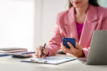 40-year-old middle-aged Asian businesswoman wearing pink suit, business finance, investment...
