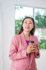 40-year-old middle-aged Asian businesswoman wearing pink suit, business finance, investment...