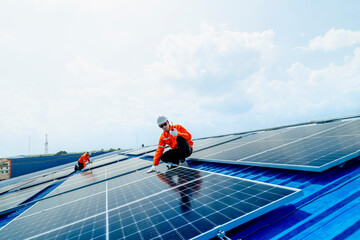 engineer man inspects construction of solar cell panel or photovoltaic cell by electronic device....