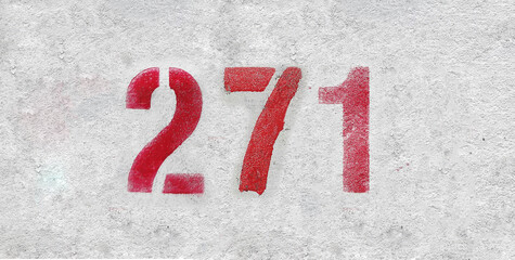 Red Number 271 on the white wall. Spray paint.