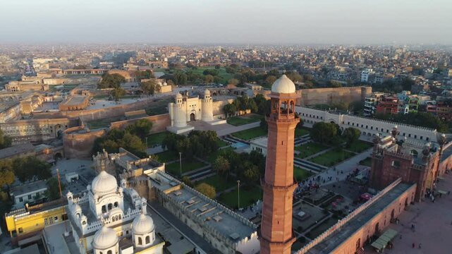 Aerial view of urban skyline with historic buildings, greenery, and roads in Lahore, Punjab, Pakistan.