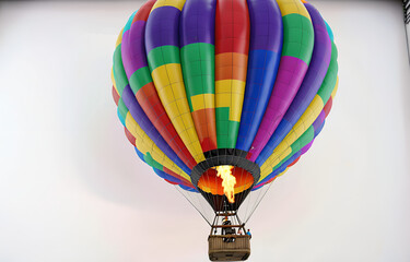 Fototapeta premium a colorful hot air balloon grounded on a ,white background,beauty