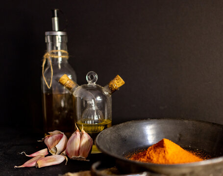 Horizontal picture of parika on a rustic black plate in a country kitchen.
