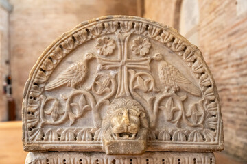 Marble piece engraved with christian symbols used as a decorationfor an ancient sarcophagus
