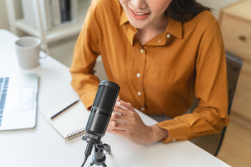 Close-up microphone on the table in podcasting record.