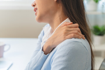 Office workers have neck pain from bad posture during sitting and work.