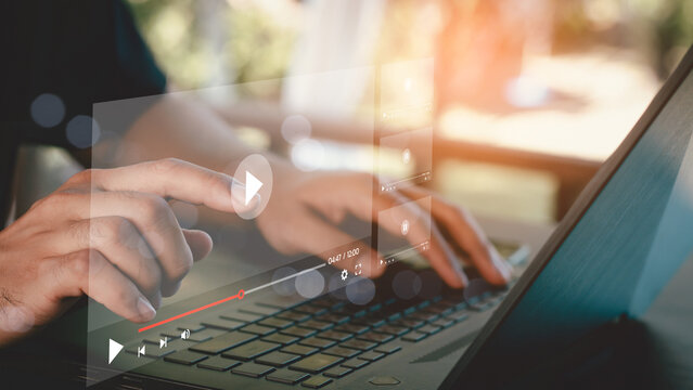 Man using mouse and keyboard to stream online on virtual screen. Video streaming on internet concept. Watch videos on the Internet, live concerts, performances or tutorials. online business content.