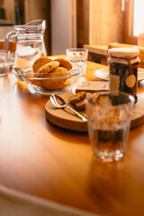 Table in wooden mountain house set for breakfast