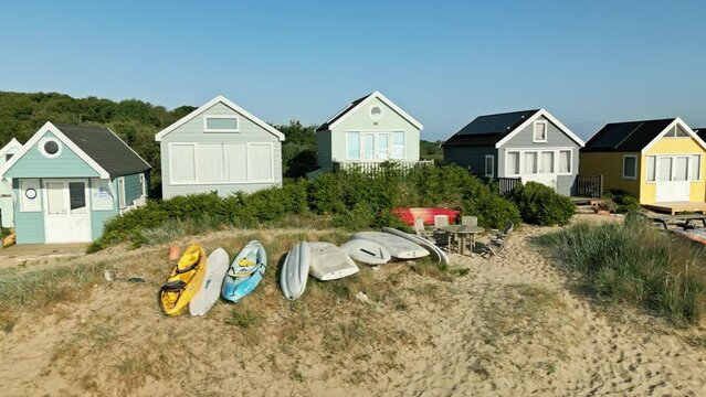 4k video of drone panning across beach huts in Mudeford, Dorset