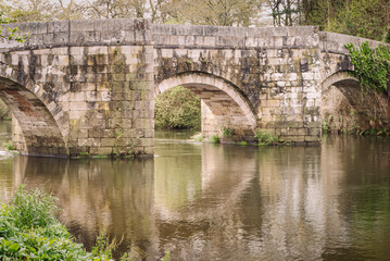 Tranquil Reflections at the Ancient Brandomil Bridge