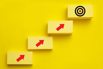 Step to Achievement; Business growth and business goal concept; Target symbol on the top of stair