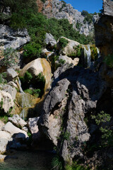 The waterfalls of the Guadalquivir River in the Utrero Cerrada, in the Sierra de Cazorla, Segura y las Villas natural park. Andalusia. Jaen. Spain