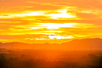 Background of trees growing along the sea coast, rain clouds covering and wind blowing blurred during the rainy season at the Noen Nang Phaya viewpoint, Chanthaburi, Thailand.