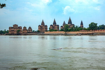 Naklejka premium Royal Chhatris or Cenotaphs are the historical monuments situated on the banks of River Betwa in Orchha, Madhya Pradesh, India.