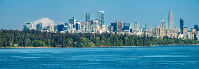 Skyline of Vancouver with Mount Rainier in the background and Stanley Park in the foreground, British Columbia, Canada