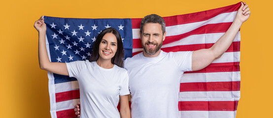 American couple on Independence Day. American couple embracing the spirit of Independence Day with flag. Independence Day holiday. couple with american flag. patriotic couple honoring Independence