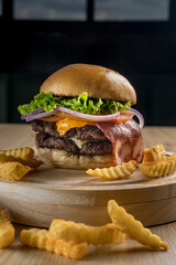 Double beef patty bacon hamburger with french fries chips