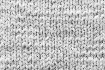Gray woolen knitted pattern as background