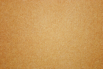 A sheet of old brown recycled cardboard texture as background