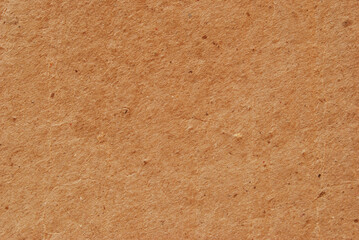 A sheet of brown recycled cardboard texture as background
