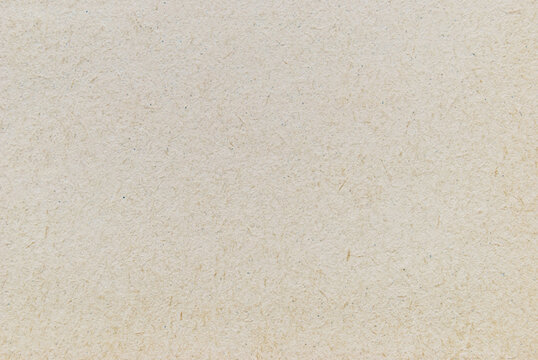 A sheet of recycled cardboard texture as background