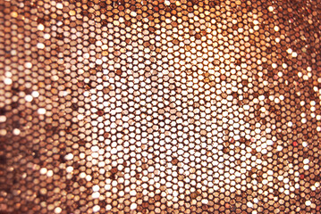 Golden overlap sequins fabric texture close up as background