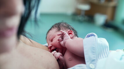 Newborn Baby Breastfeeding Immediately After Birth, Emphasizing Early Maternal Bonding and...