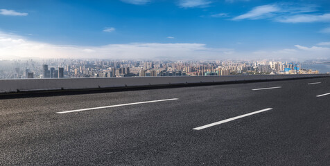 Urban Highway Overlooking Cityscape with Blue Sky