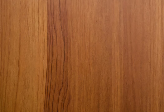 Close-up of smooth, light brown wood grain with natural vertical lines. Ideal for backgrounds, textures, or showcasing woodworking projects.