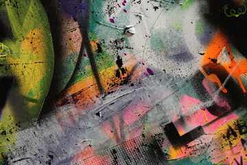 Abstract grunge and graffiti background features a layered look with bright and dark elements.