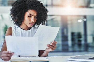 Frustrated, reading and woman in office with documents invoice and budget management. Stress, admin lady and company paperwork in workplace for review, development and analysis of business report