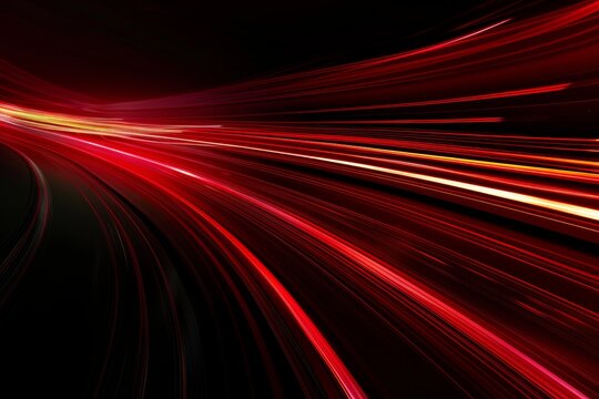Abstract red lines depict the speed of the road in red. Red light trails on a dark background, with a high speed and fast motion blur effect.