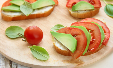 healthy eating avocado with tomatoes and basil