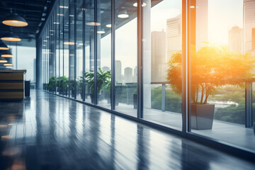 Beautiful blurred background of a light modern office interior with panoramic windows and beautiful lighting.