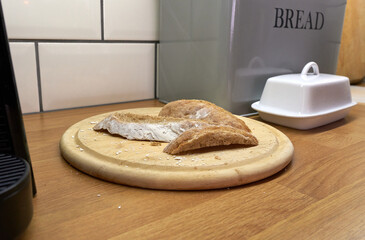 Sliced sourdough bread crusts on a wooden chopping board