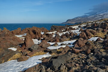 Russia. Far East, Kuril Islands. Very hard and sharp basalt rocks along the coast of the Sea of...