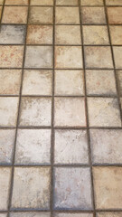 floor tiles background in tan on the floor closeup background concept
