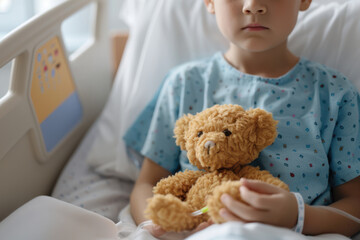 Child in hospital bed holding teddy bear, conveying hope and comfort. Medical care for pediatric patient, emotional support during recovery.