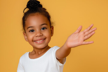A cute little girl with her hand extended to the camera on yellow background. Generative AI.
