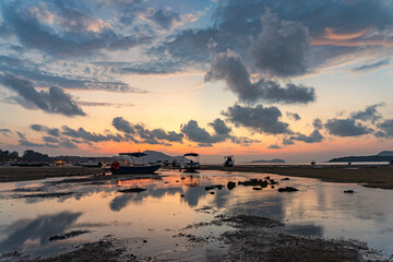 sweet sky cloudscape in sunrise at Rawai beach Phuket. colorful light through to the cloud above the ocean. Scene of Colorful romantic sky sunset background. sweet sky cover the sea background..