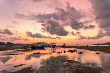 Scenery The sweet sky in sunrise over the fishing port..stunning sunrise at the sea in twilight....
