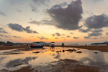 sweet sky cloudscape in sunrise at Rawai beach Phuket. colorful light through to the cloud above the ocean. Scene of Colorful romantic sky sunset background. sweet sky cover the sea background..